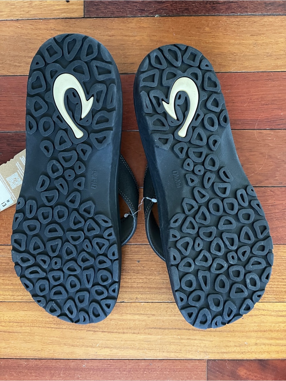 OluKai Black Flip-Flop with Cream Logo Accent